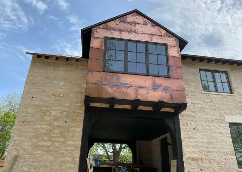 Copper metal panel facade on a stone building for Metal Roof Coating in Schodack